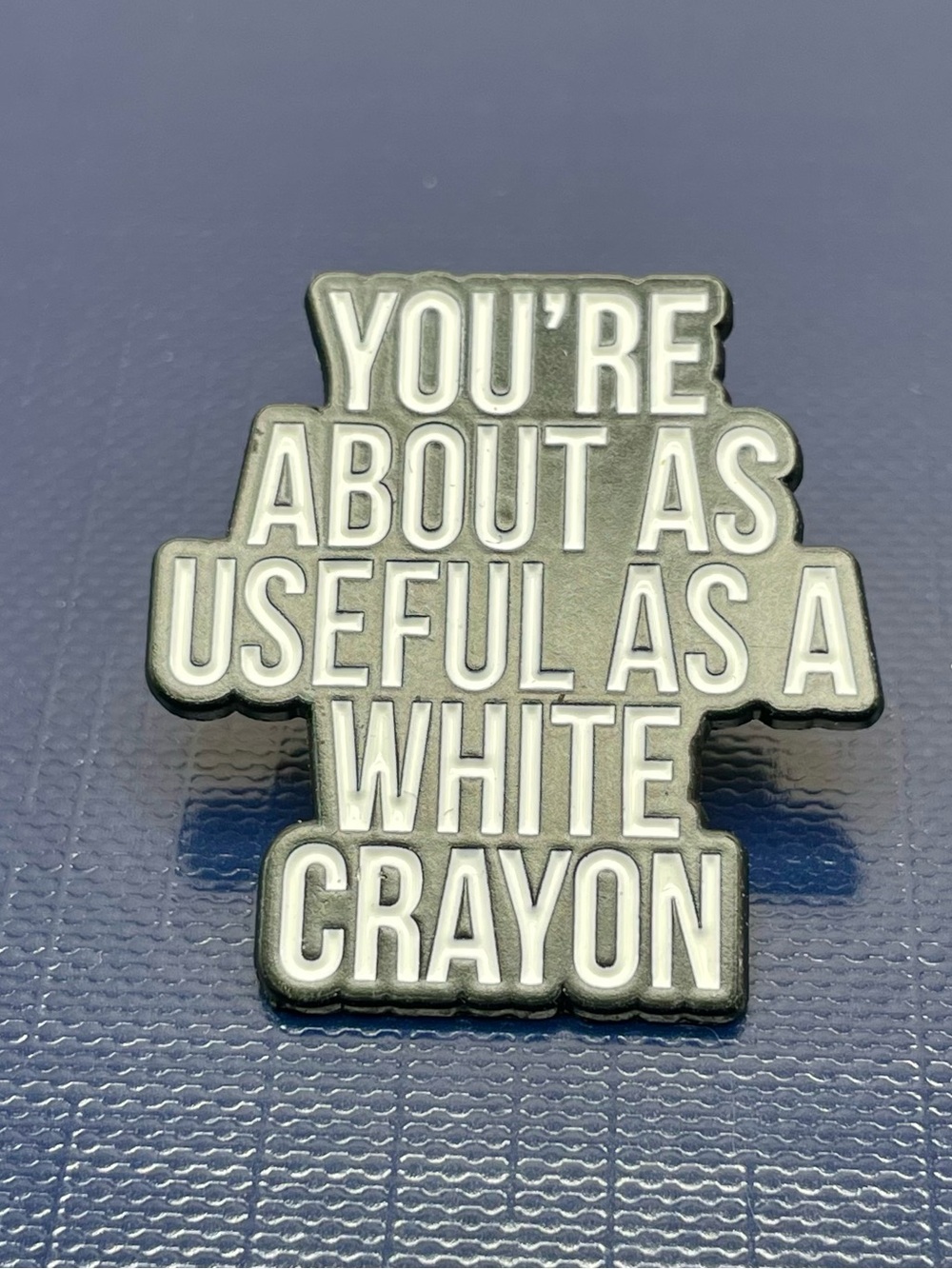 'You're About As Useful As A White Crayon' Statement Pin - White & Black